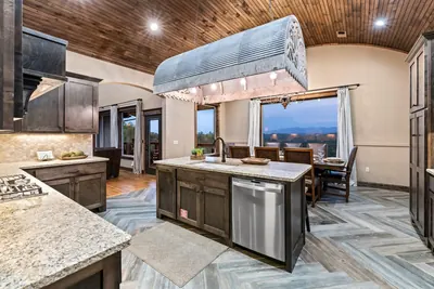 Chef's kitchen with granite island and mountain-view windows