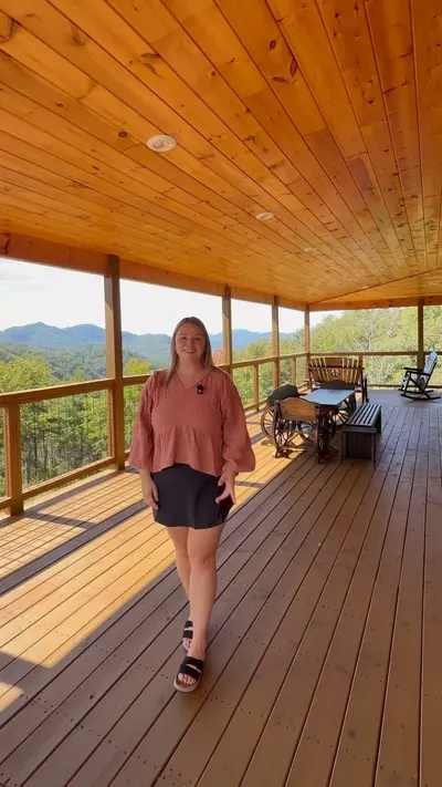 Guest relaxing on a covered porch with mountain views