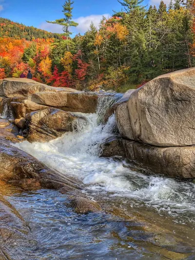 Waterfall over boulders with autumn foliage in the Smokies